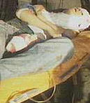 Officials carry out a victim of the Luxor attack for medical attention